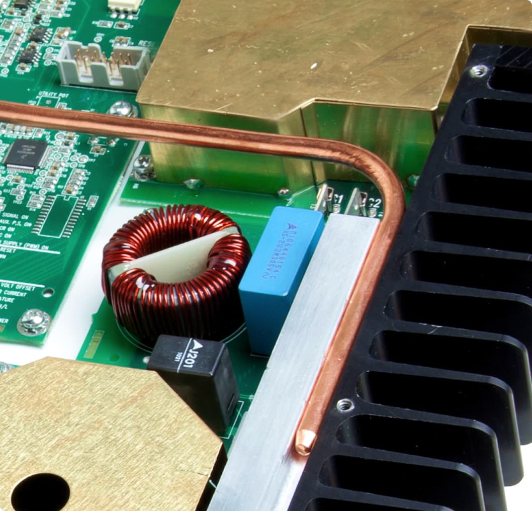 Living room setup showing MDX-16 front panel and SFC-12SW in-wall subwoofer